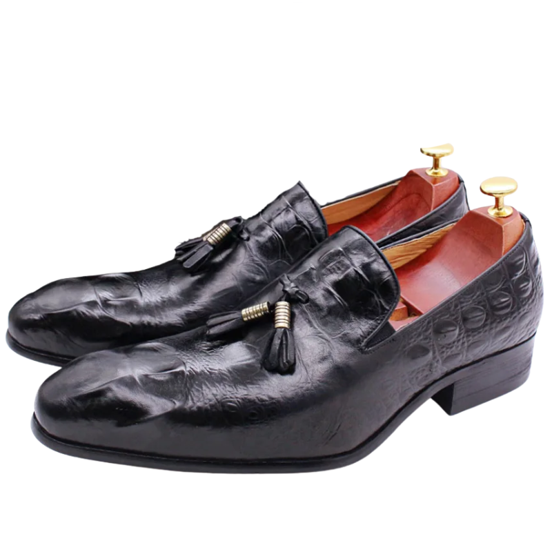 Black leather loafers with tassels on a white background