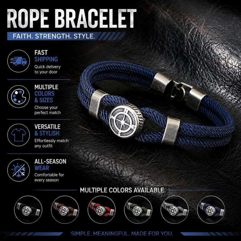 A rope bracelet with a blue braided strap and a silver-toned compass-style clasp, displayed on a dark textured leather background