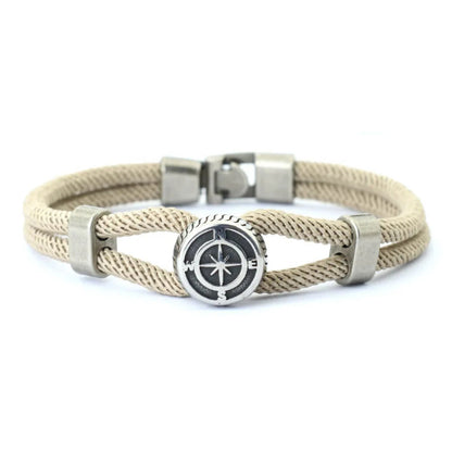 Beige braided bracelet with silver clasp and compass design