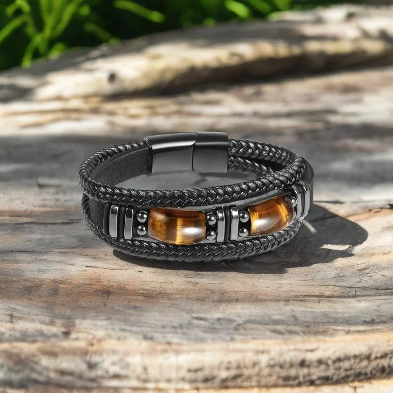 Multistrand bracelet with black braided cord, metal accents, and wooden beads 