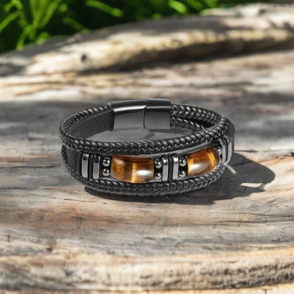 Multistrand bracelet with black braided cord, metal accents, and wooden beads 