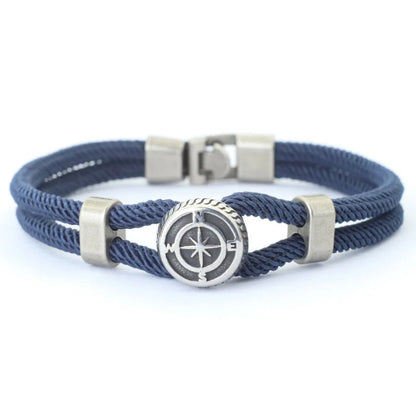 Navy blue braided bracelet with silver compass charm