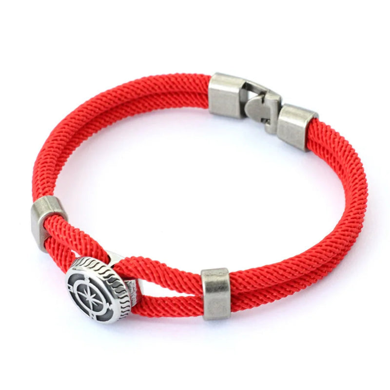Red braided bracelet with silver clasp and charm